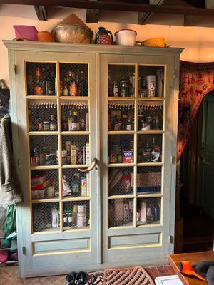 a large cabinet with many items on top of it