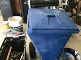 a blue cart that is sitting in a garage