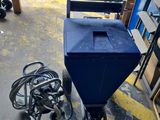 a blue cart that is sitting in a garage