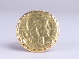 an image of a gold coin with a woman on it