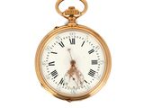 une montre de poche en or avec des chiffres romains sur le cadran