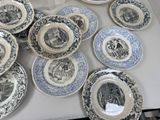 many plates that are sitting on a table