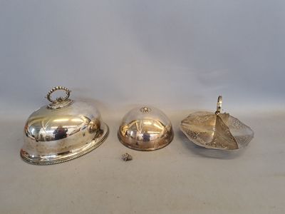 three silverplated dishes on a white surface with a white background