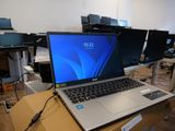 a laptop computer sitting on a table in a room