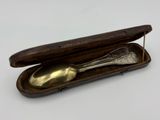 a spoon in a case with a spoon in it