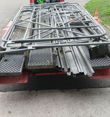 a truck that has a bunch of metal bars on the back of it