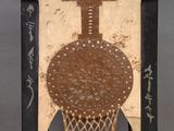 an old wooden table with a decorative design on top of it