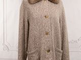 an image of a coat with a fur collar on a mannequin stand