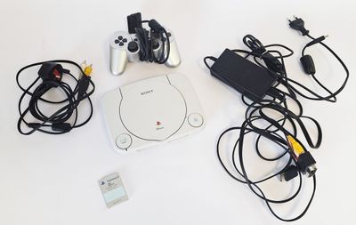 a video game console and other electronics on a table