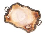 a silver tray with a handle on a white surface