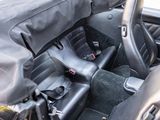 a black car with a black seat cover and a black seat belt