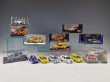 a group of toy cars in display cases on a white surface