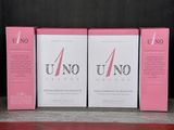 trois boîtes de cartes de jeu Uno posées sur une étagère