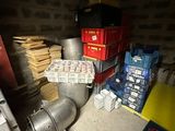 a room with a bunch of boxes and a metal pipe