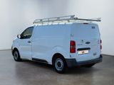 a white van that is parked in a room