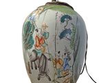a lamp that has a picture of a man riding a horse on it