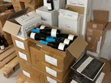 boxes of wine are stacked on top of each other in a room