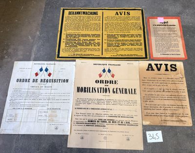 some old papers are sitting on the floor next to a pair of scissors