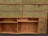 an old wooden cabinet with two drawers on it