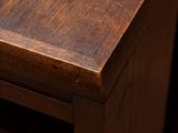 a close up of a wooden table with a book on it