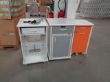 a white and orange kitchen set in a warehouse