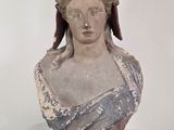 a statue of a woman with a hat on her head