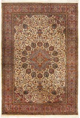an antique persian rug with a medallion design on a beige ground