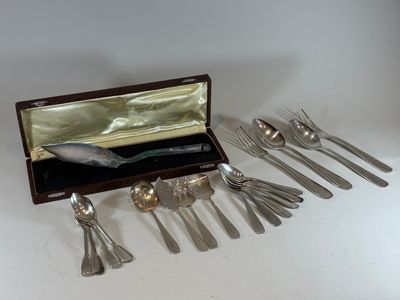 a set of silverware in a wooden box on a table