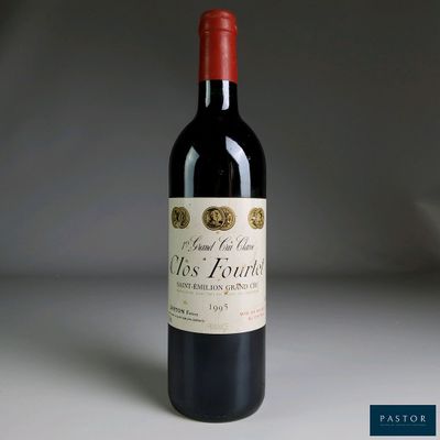 a bottle of wine that is sitting on a table