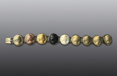 a group of five gold and silver coin bracelets