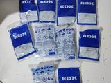 six bags of kool next to each other on a table