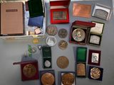 a lot of coins and other items that are on the table