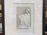 une image représentant le dessin d'une femme assise sur un banc