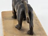 statue of a lion on a marble block on a white background