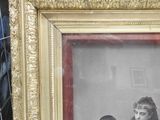 a picture of a man and two children in a picture frame
