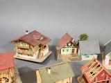 a lot of small model houses that are on a table