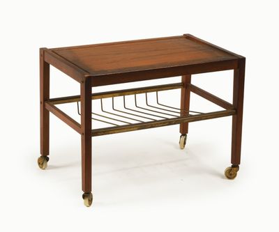 an image of a wooden table with a magazine rack on it