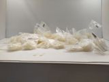 many bags of food sitting on the counter in the microwave