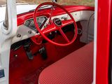 a red and white car with a steering wheel and dashboard