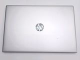 a white laptop with a hp logo on it