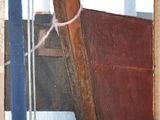 a picture of a painting of a boat on the wall