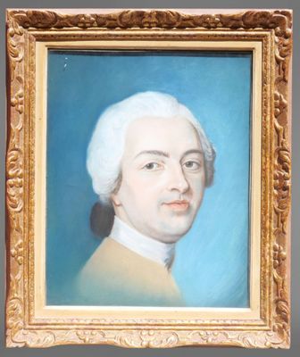 portrait of a man with white hair in a gold frame