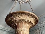 a chandelier hanging from the ceiling in a room