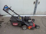 a lawn mower that is sitting on the ground