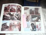 a picture of a comic book open on a bed