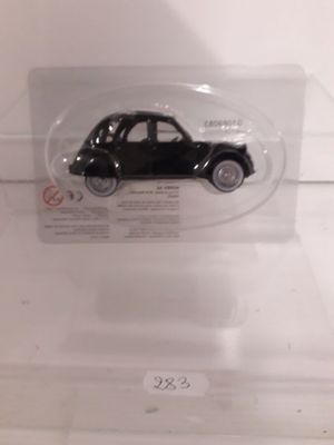 a small black car in a clear plastic box