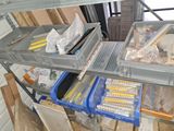 many boxes that are sitting on a shelf in a room
