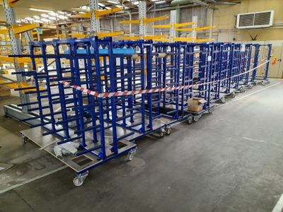 a large warehouse with a lot of shelves and pallets