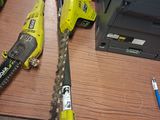 two chainsaws that are sitting on a table