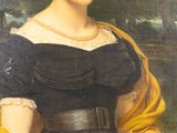 portrait of a woman in a black dress with a yellow shawl